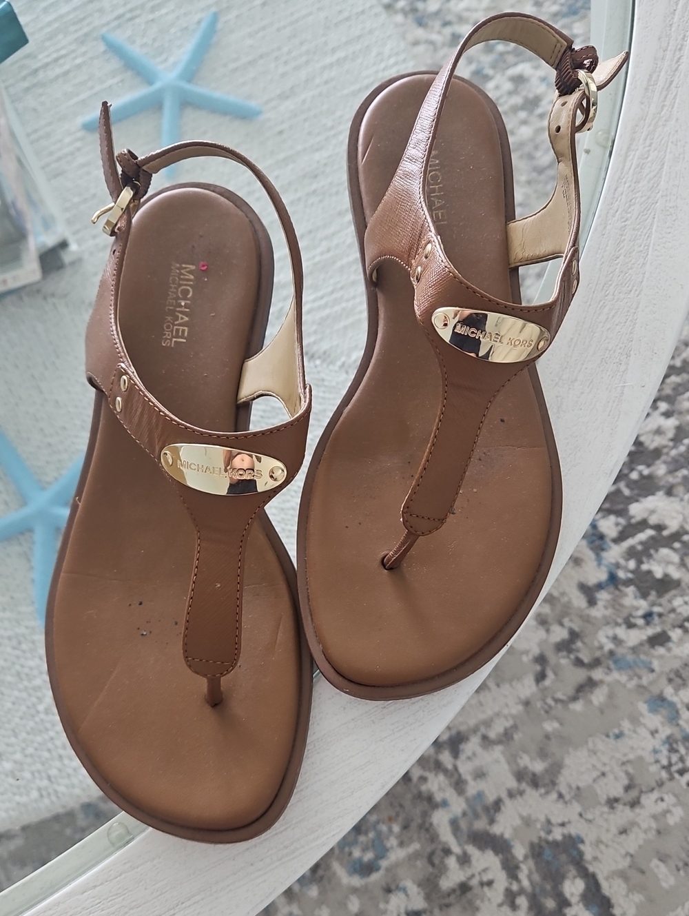 Michael Kors Brown Leather T-Strap Sandals with Gold Plaque